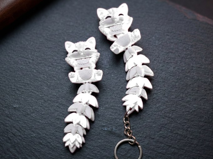 Jade White flexi cat keychain
